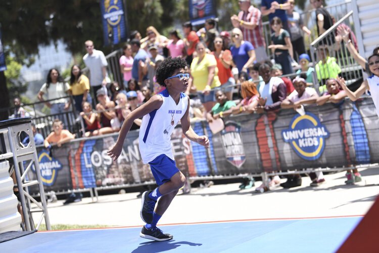 Nathanael Honvou  competing in age group 9-10 on American Ninja Warrior Junior - Season 2.